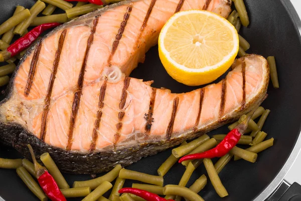 Fresh salmon steak on pan. — Stock Photo, Image