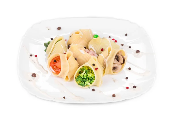 Pasta shells stuffed with vegetables and sausage. — Stock Photo, Image