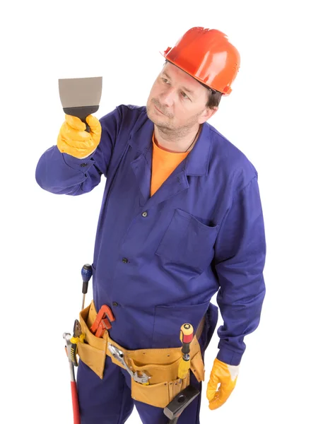 Trabajador en gorro duro sosteniendo espátula . — Foto de Stock