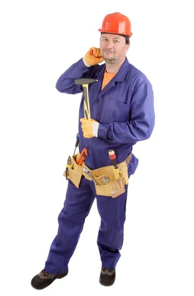 Pracovník v čepice drží kladivo. — Stock fotografie