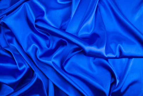Textur aus blauem Seidenstoff — Stockfoto