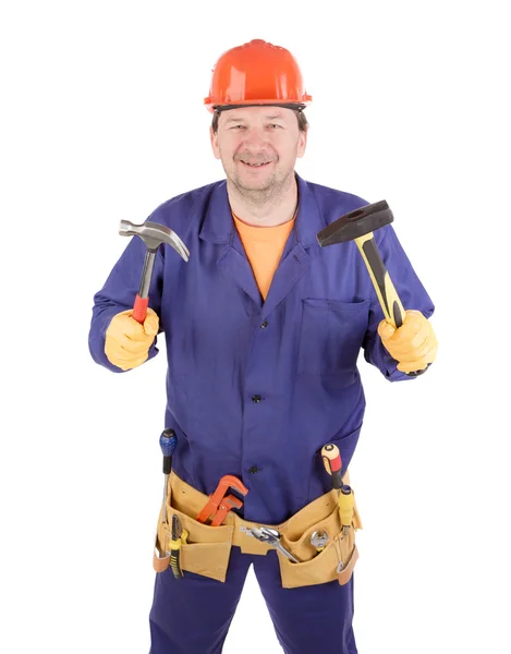 Worker in hard hat holding hammers. — Stock Photo, Image