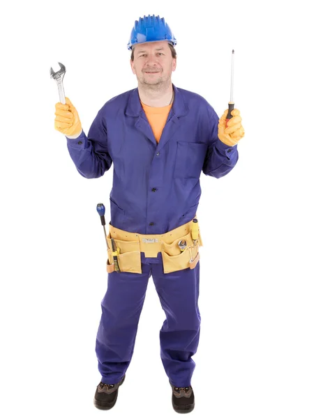 Worker holding wrench and screwdriver. — Stock Photo, Image