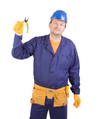 Worker in protective helmet with tools.