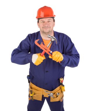 Worker in protective helmet with tools.