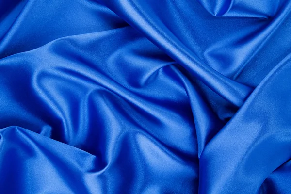 Blue silk folds texture close up. — Stock Photo, Image