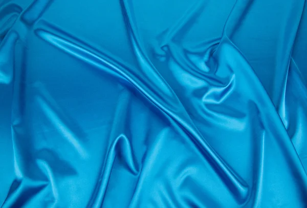 Panno pieghe di seta azzurro . — Foto Stock