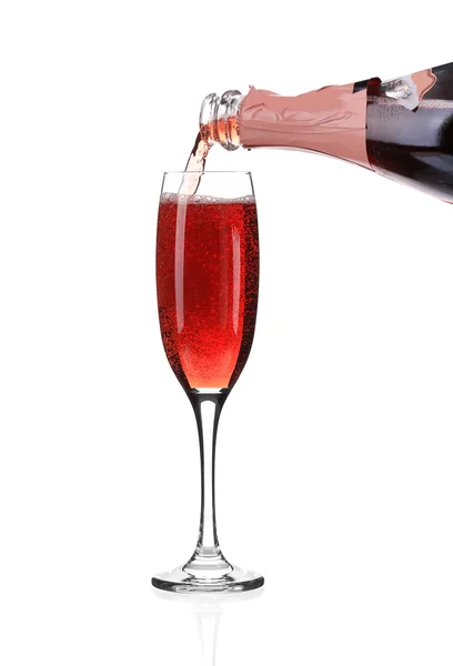 Red champagne pouring in a glass. — Stock Photo, Image