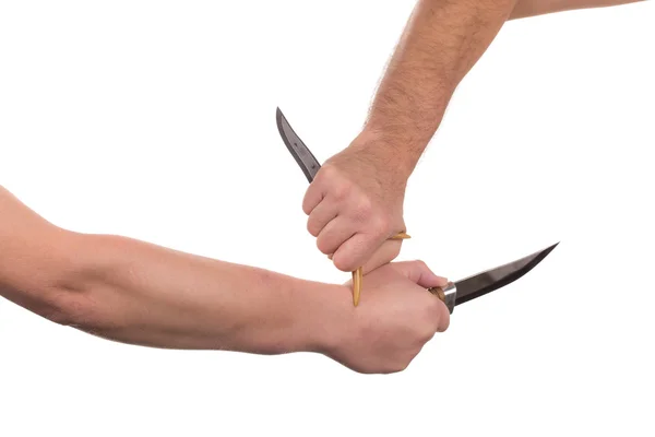 Blocking arms with a knife. — Stock Photo, Image