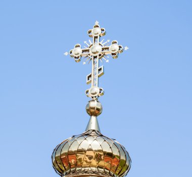Golden dome with a cross of the Church 