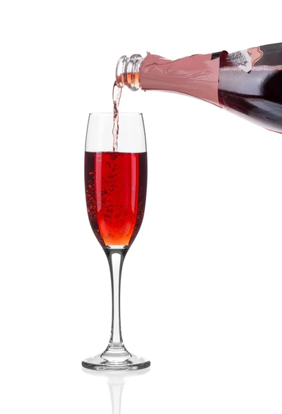 Red champagne pouring in a glass. — Stock Photo, Image