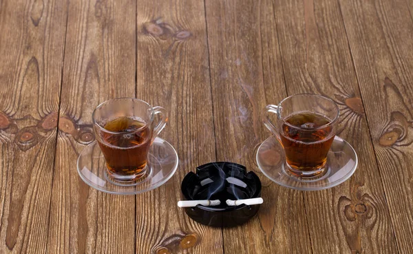 Cups of tea with cigarettes — Stock Photo, Image