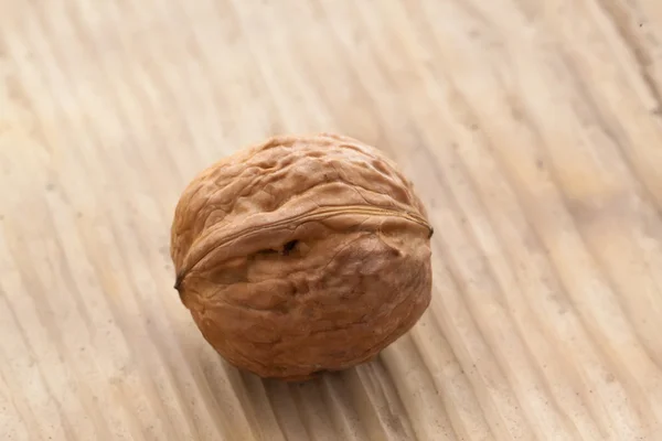 Walnut on old wooden background — Stock Photo, Image