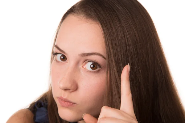 Junge Frau mit erhobenem Finger — Stockfoto