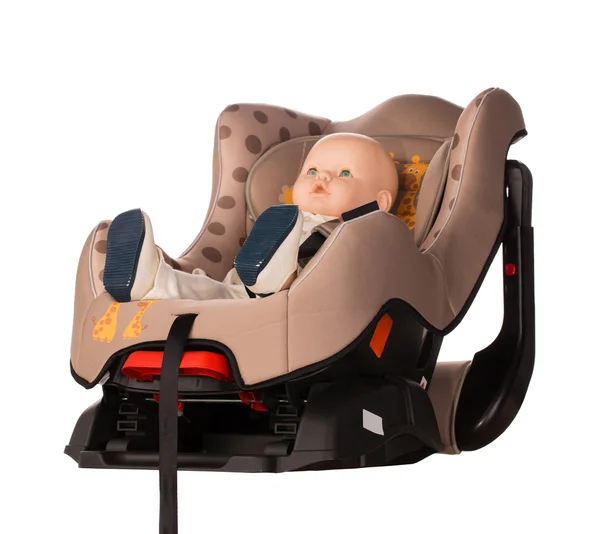 Baby doll fastened in  booster seat — Stock Photo, Image