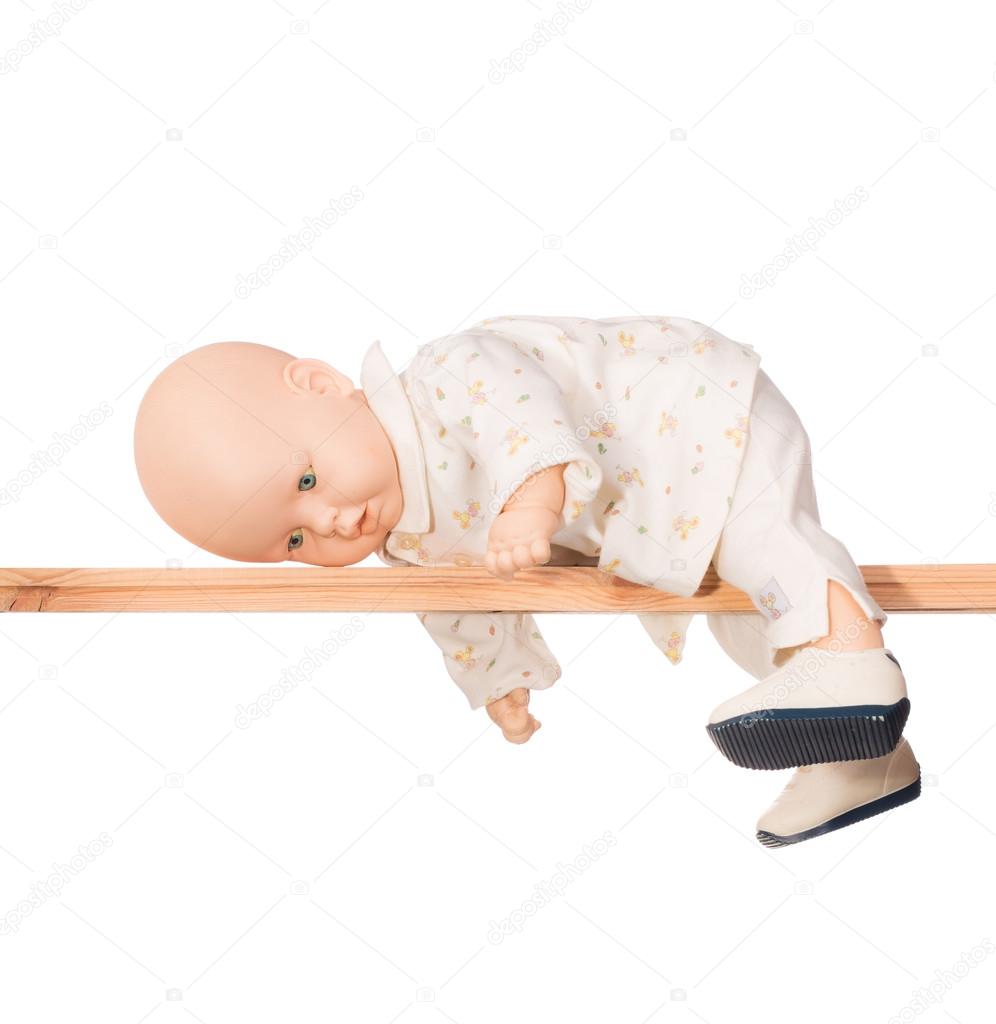 Baby doll on a crossbar