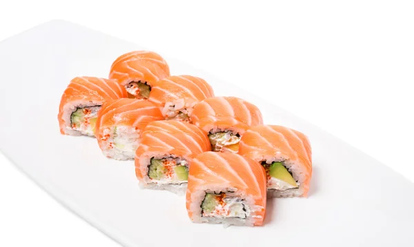 Rotoli di salmone Uramaki con avocado . — Foto Stock