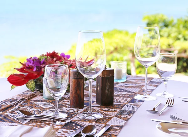 Table in the restaurant on the sea background — Stock Photo, Image