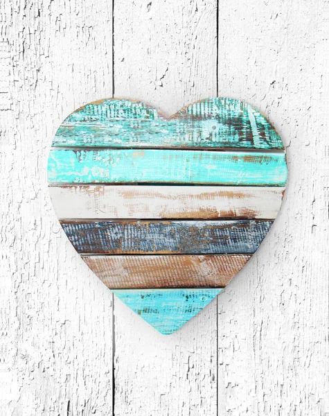 Wooden heart on grungy wooden texture — Stock Photo, Image