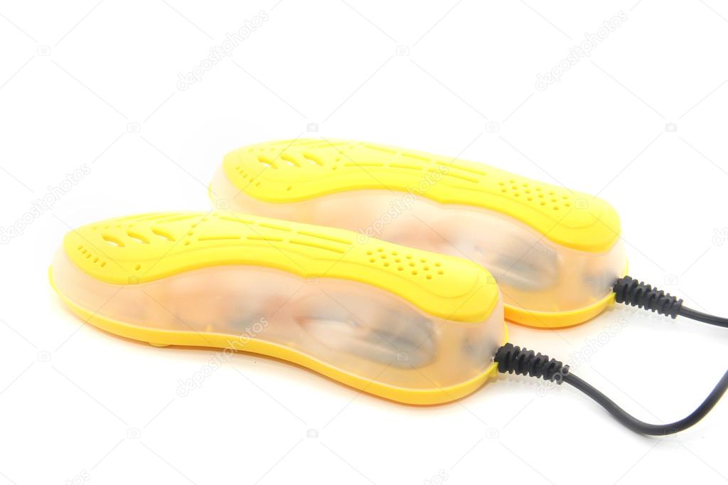 Yellow shoe dryer isolated on white background