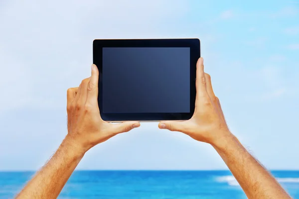 Hands holding a tablet — Stock Photo, Image