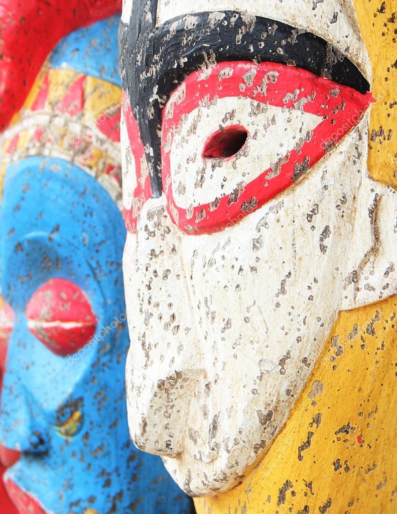 Wooden carved  ritual  statue face. Selective focus