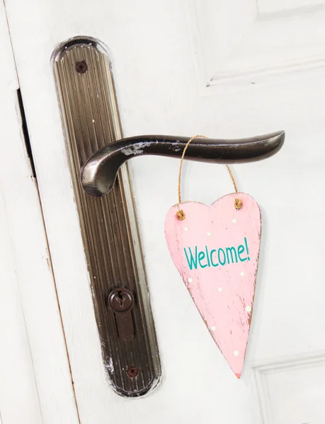 Heart hanging on the door handle — Stock Photo, Image