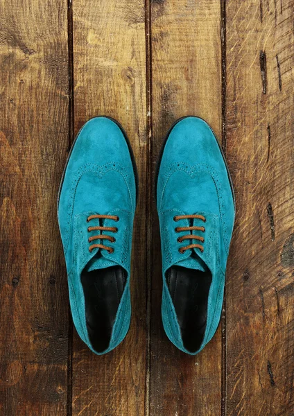 Male shoes on a brown wooden background — Stock Photo, Image