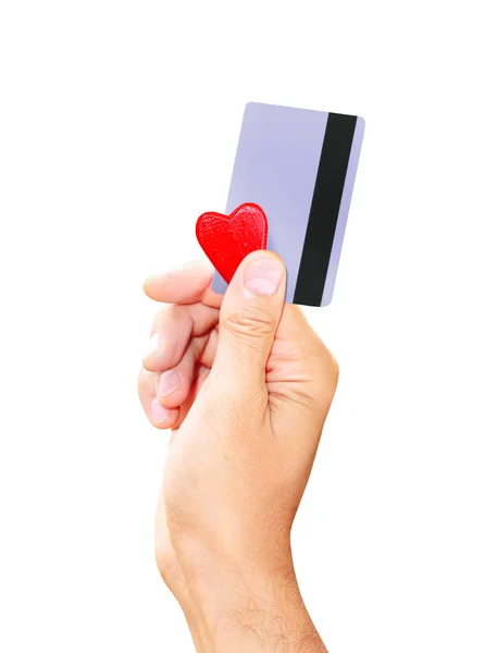 Man met een credit card en een kleine hart geïsoleerd witte achtergrond — Stockfoto