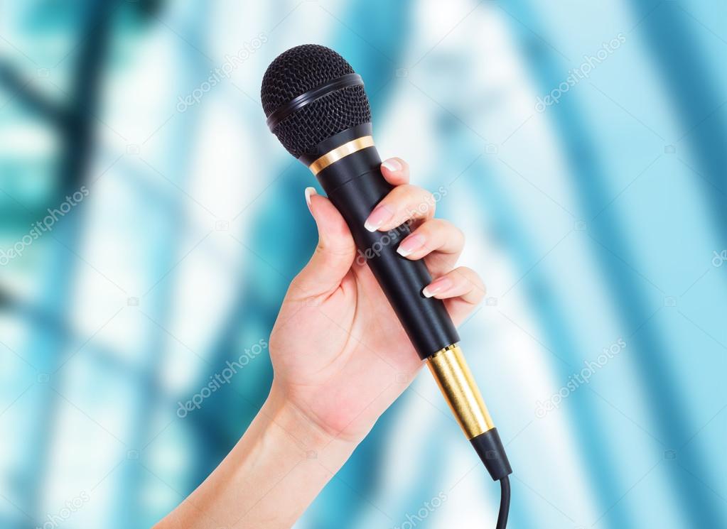 female Hand with microphone