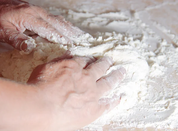 Older woman hands knead dough — Stock Photo, Image