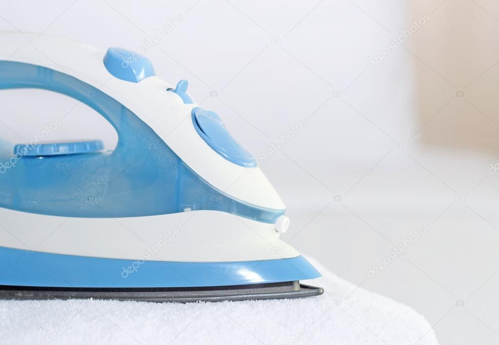 Blue iron to iron the towel closeup
