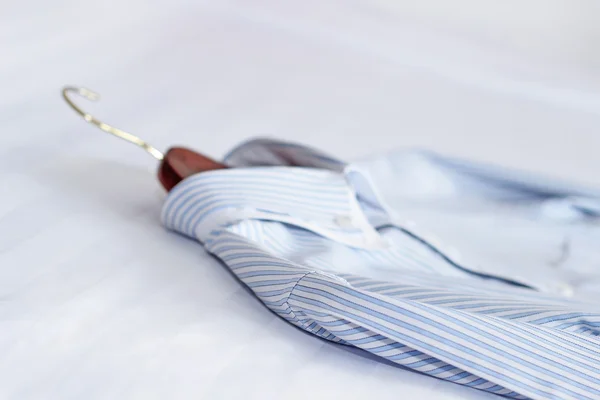 Men's classic shirts on the bed. Shallow depth of field — Stock Photo, Image