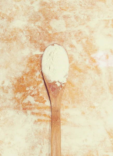 Wooden spoon with flour on wood background. instagramm filter effect — Stock Photo, Image