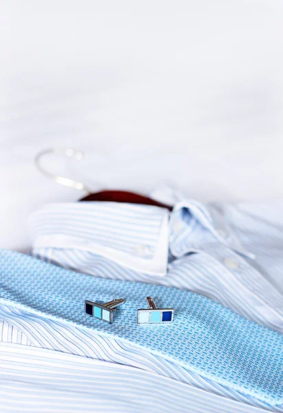 Men's classic shirts on the bed. — Stock Photo, Image
