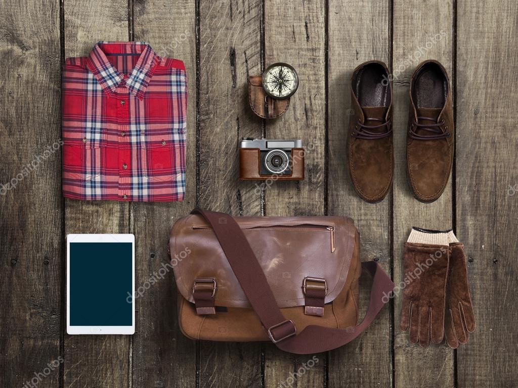 Hipster clothes and accessories on a wooden background Stock Photo by  ©apolobay 79015776