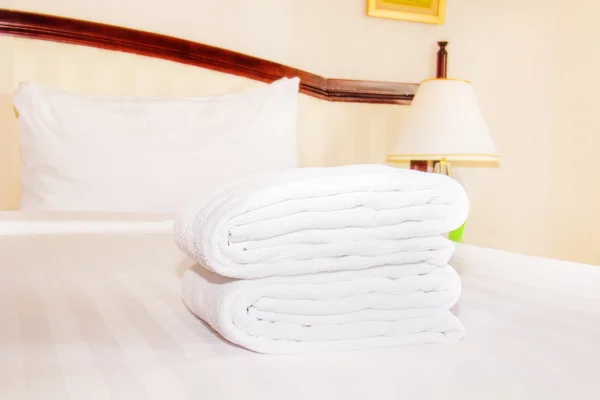 Clean towel  on the bed Stock Photo