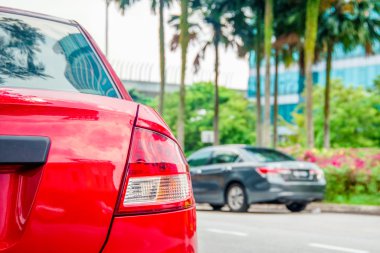 cars parked beside the road. clipart