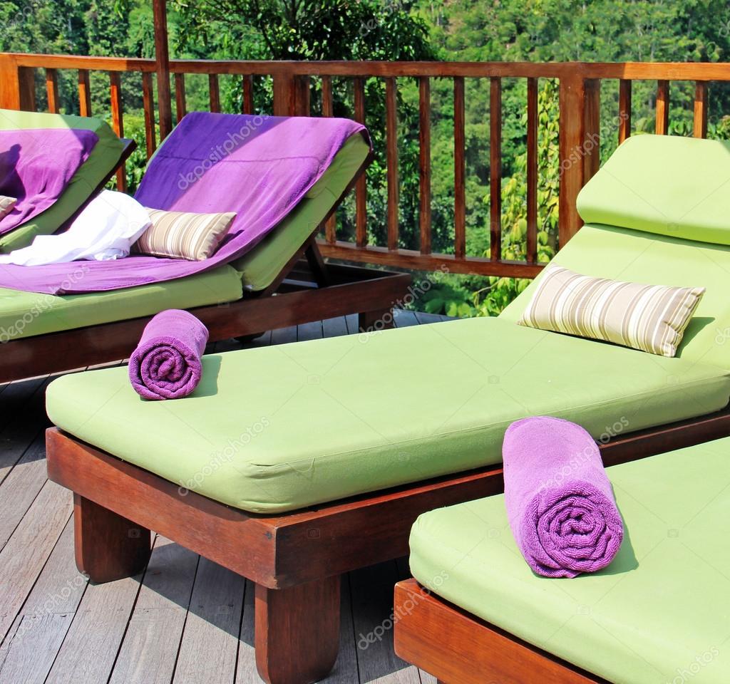 Deck chairs by the pool — Stock Photo © apolobay 87018796