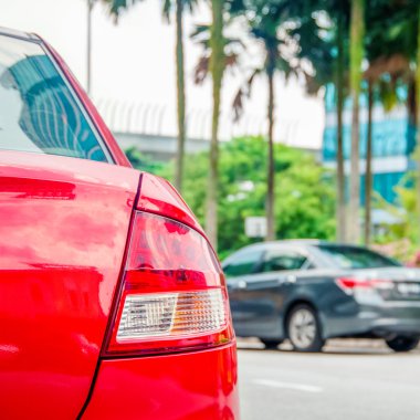 cars parked beside the road. clipart