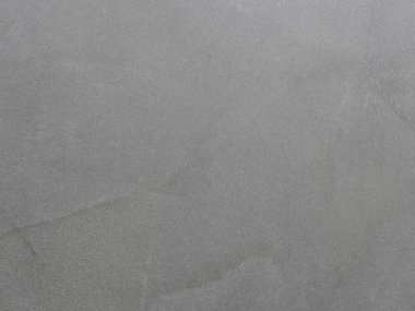 Oturma odasındaki beton renginde boyanmış duvar dokusu