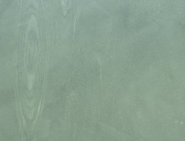 Duvarın dokusu soyut dekoratif alçıyla süslenmiş.