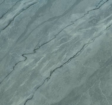 Duvarın dokusu soyut dekoratif alçıyla süslenmiş.