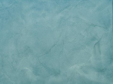 Duvarın dokusu soyut dekoratif alçıyla süslenmiş.