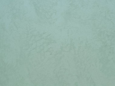 Duvarın dokusu soyut dekoratif alçıyla süslenmiş.