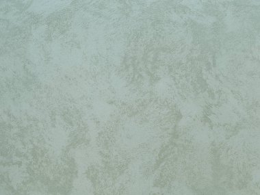 Duvarın dokusu soyut dekoratif alçıyla süslenmiş.