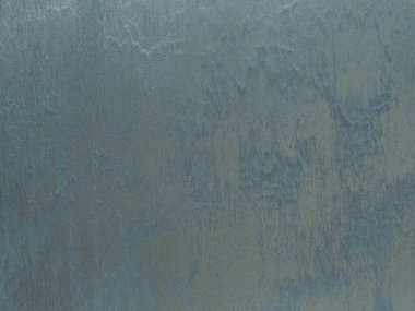 Duvarın dokusu soyut dekoratif alçıyla süslenmiş.