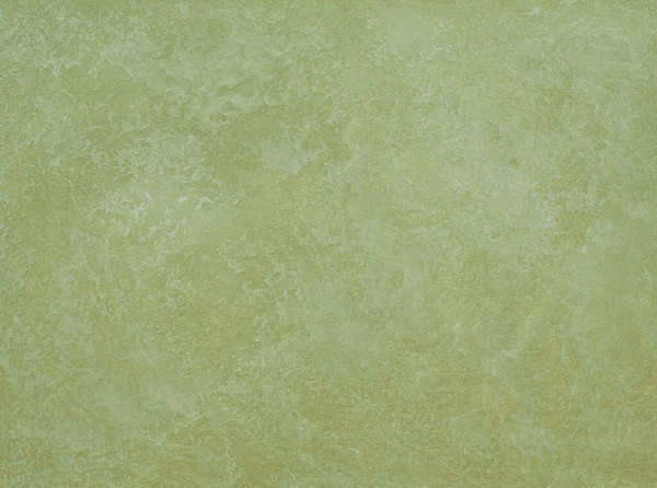 Duvarın dokusu soyut dekoratif alçıyla süslenmiş.