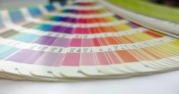 Color guide palette. Choosing colors from catalog samples for printing proofing.