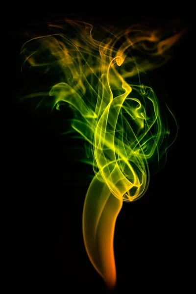 Colored smoke isolated on black — Stock Photo, Image